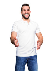 Young happy man in a white polo shirt