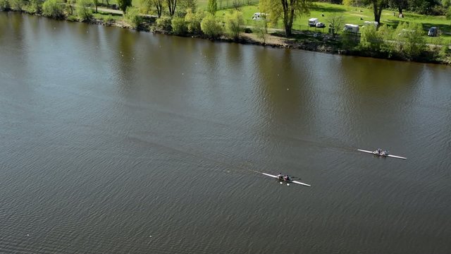 rowers in boats on the river