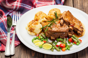 Pork spareribs served with mashed potatoes