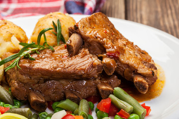 Pork spareribs served with mashed potatoes