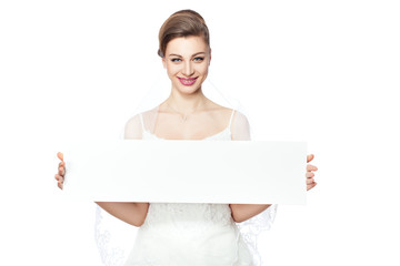 Bride is holding a billboard.