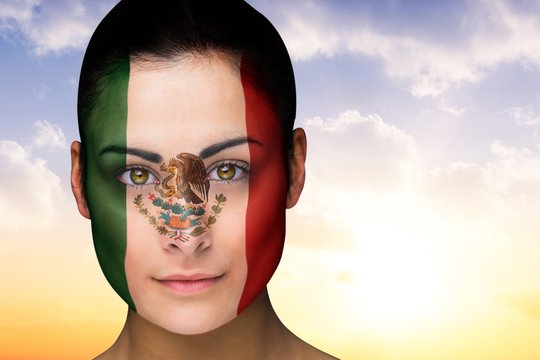 Composite image of beautiful brunette in mexico facepaint