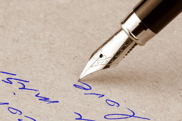 Fototapeta premium Fountain pen writing on the paper
