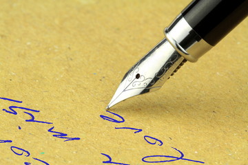Fountain pen writing on the paper