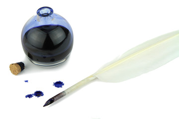 Quill pen with ink blots and glass ink bottle