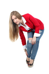 Casual woman in red  smiling standing isolated over a white back