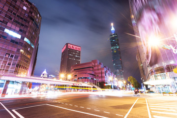 Fototapeta premium Car light trails and urban landscape in modern city
