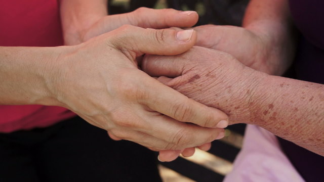 Holding Older Woman Hands Dolly