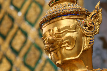 Golden Buddhistic statue in a temle