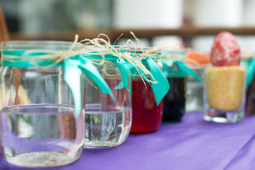 Colorful paints on palette with brushes ready