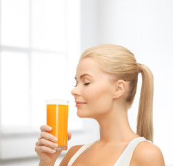 young woman drinking orange juice