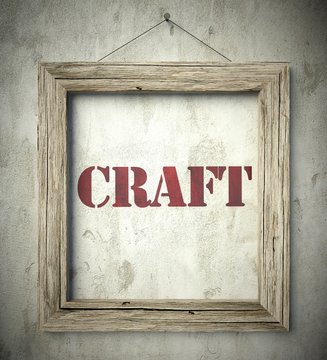 Craft in old wooden frame on wall