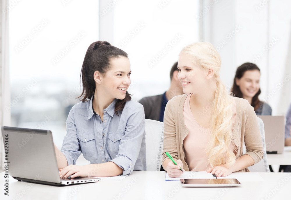 Wall mural students with laptop, tablet pc and notebooks