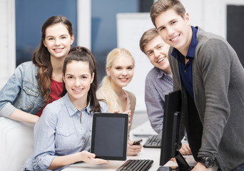 Fototapeta premium students with monitor and blank tablet pc screen