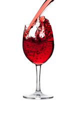 red wine pouring into wine glass isolated