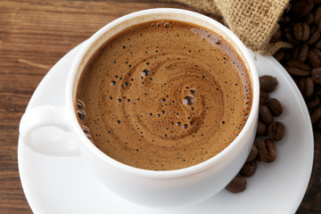 white coffee cup on wood background