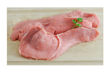 trois escalopes de veau sur planche