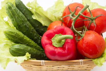 cucumbers, tomatoes, peppers, lettuce in basket