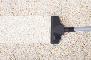 Vacuum Cleaner On Rug At Home - obrazy, fototapety, plakaty