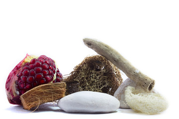 Spa and wellness setting with pomegranate, wooden parts, natural