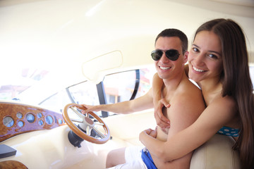 young couple on yacht