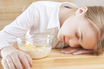 Obraz na płótnie Canvas Portrait of Teenager Girl Sleeping on Table Surface