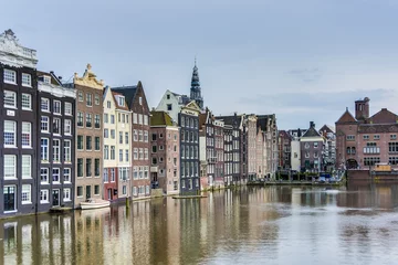 Fototapete Rund The Damrak canal in Amsterdam, Netherlands. © Anibal Trejo