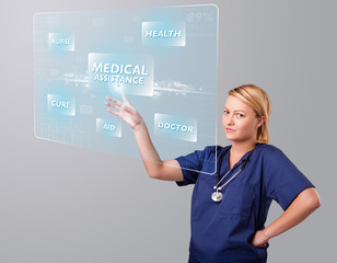 Young nurse pressing modern medical type of buttons
