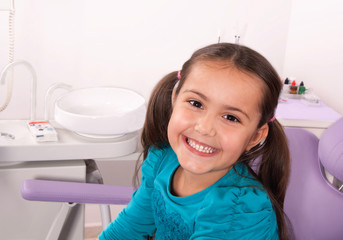 cute little girl smiling in the dental chair