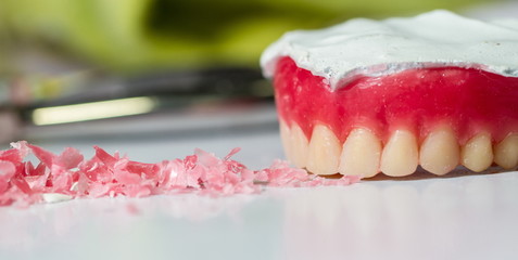 Wax dentures model. table of dental technician workplace.