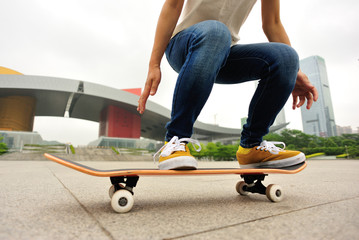 skateboarding woman jump