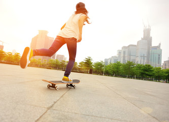 skateboarding woman at city © lzf