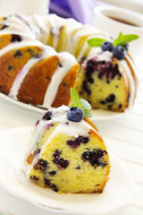 Kugelhopf cake with blueberries and lime, with a glaze.