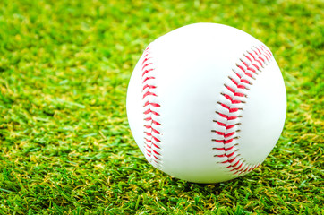 Baseball on green grass