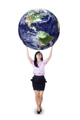 Businesswoman holding the earth isolated