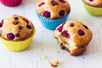 Bitten muffin on white table