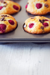 Delicious muffins placed in black tray