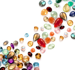 Bright real semiprecious and precious gems on white background.