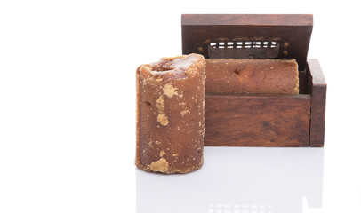 Brown coconut sugar in a wooden box 