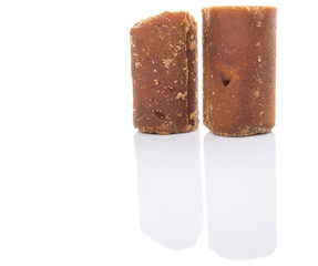 Brown coconut sugar over white background