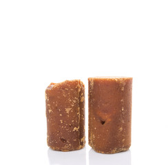 Brown coconut sugar over white background