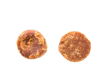 Brown coconut sugar over white background