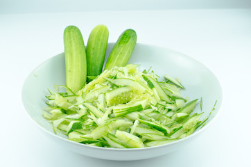 Cucumber and slices isolated over white background