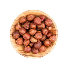 Obraz premium Hazelnuts in a wooden bowl