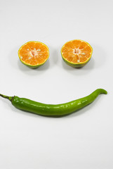 tangerine or mandarin fruit and hot chili peppers