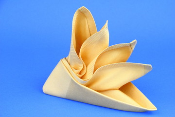 Folded napkin on the blue