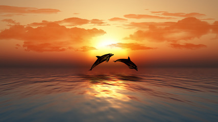 Sunset ocean with dolphins jumping