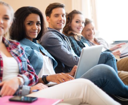 Group of students preparing for exams in apartment interior