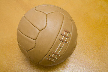 Retro ball  on orange background / Retro leather football