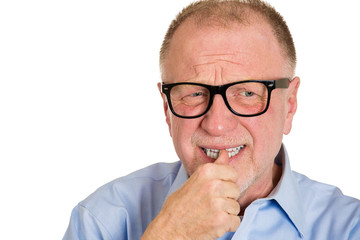 Stress. Anxious senior man biting finger nails, white background